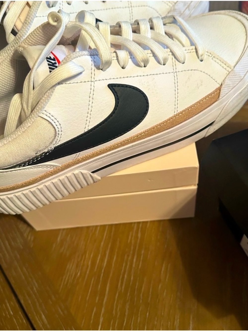 Nike White Sneakers with Black Swoosh and Tan Stripe